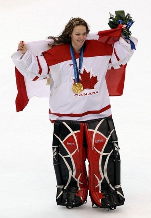 Canada's goalie Shannon Szabados and Marie-Philip Poulin celebrate